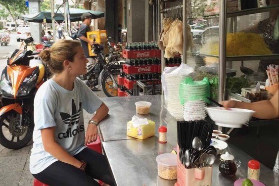 Experiencing Vietnamese street food (Photo: Annie Edwards, Roaming Hunger)