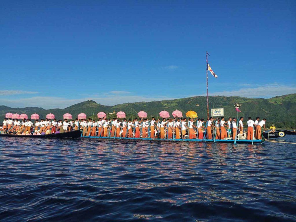 Festival boats glide past