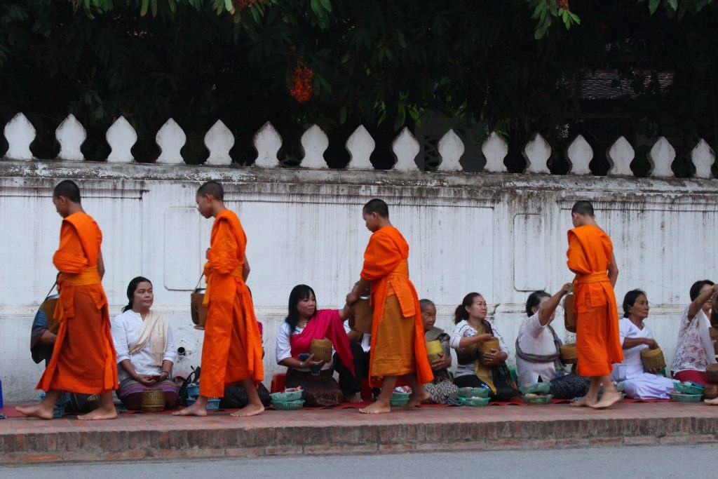 monks collecting alms in Luang Prabang, Laos